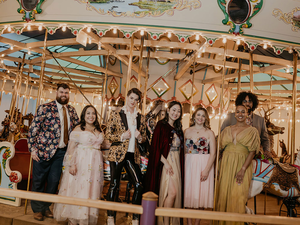 Group of adults standing at the Carousel.